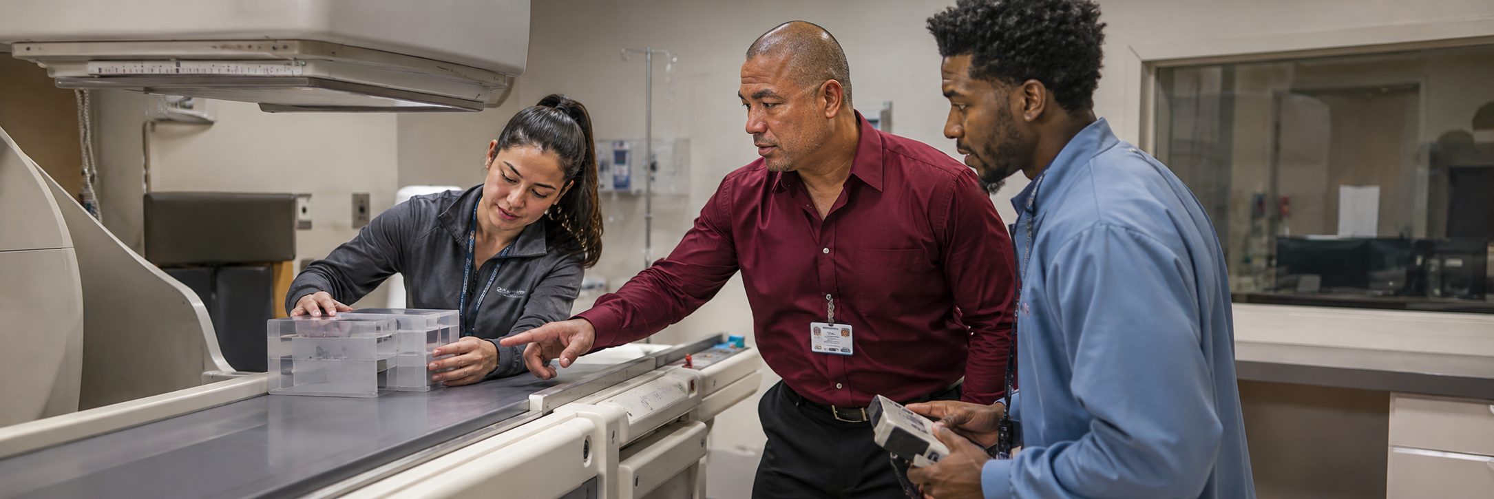 Operating room surgical light inspection and service | BiomedRx HTM services HTM technicians inspecting operating room surgical lights during scheduled service
